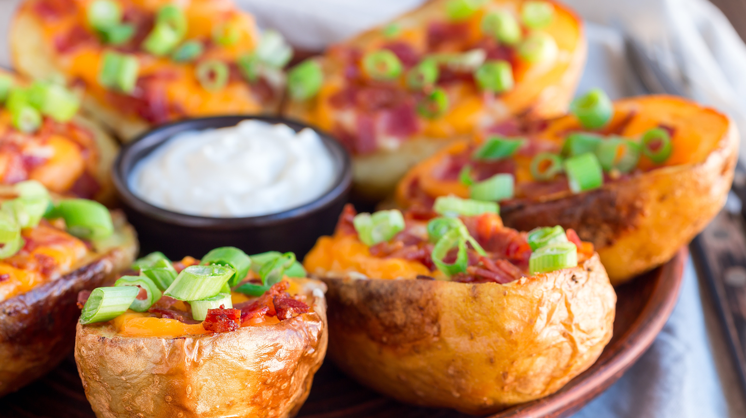 Baked potato skins filled with melted cheese and crisp bacon bits make for a flavorful and hearty appetizer. This recipe uses simple, readily available ingredients and easy-to-follow steps. Whether you're throwing a party or just in the mood for a snack, you can't go wrong with these tasty potato skins.